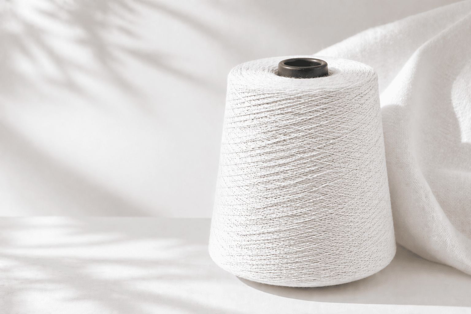 Premium yarn on cones, ready for industrial textile production.